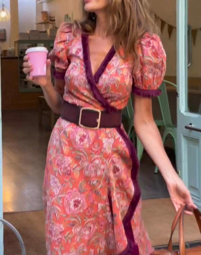 Miriam - Elegante vestido largo con mangas cortas abullonadas y falda asimétrica