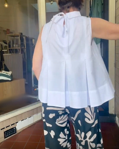 Sana – Blusa lisa sin mangas de estilo minimalista y chic